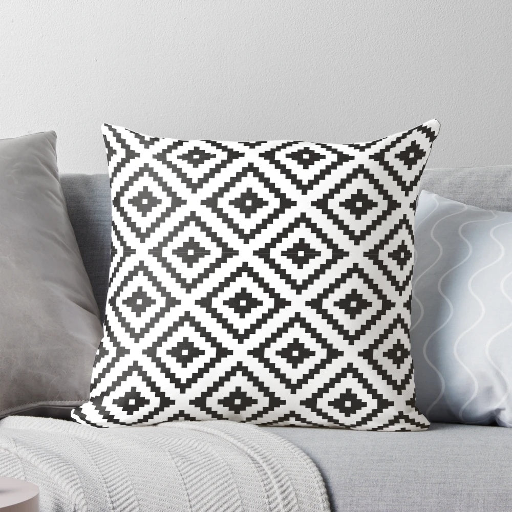 Aztec-inspired black and white throw pillow with tribal pattern design, perfect for modern farmhouse home decor.