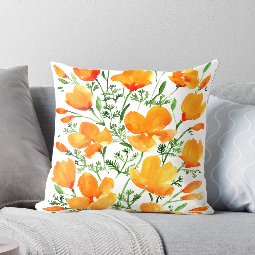 Watercolor painting of vibrant California poppies on a decorative throw pillow