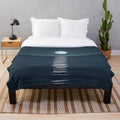 Plush blanket with a stunning moonlit seascape design