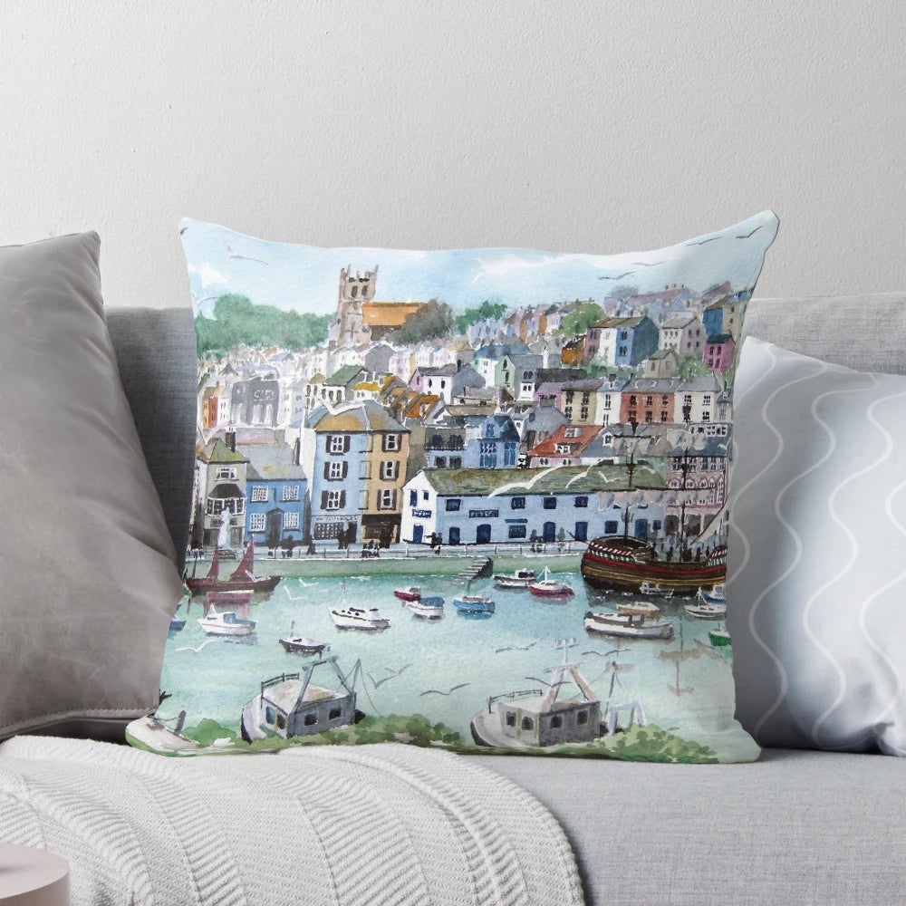 Cozy pillow featuring a picturesque fishing village scene in Brixham, Devon, England.