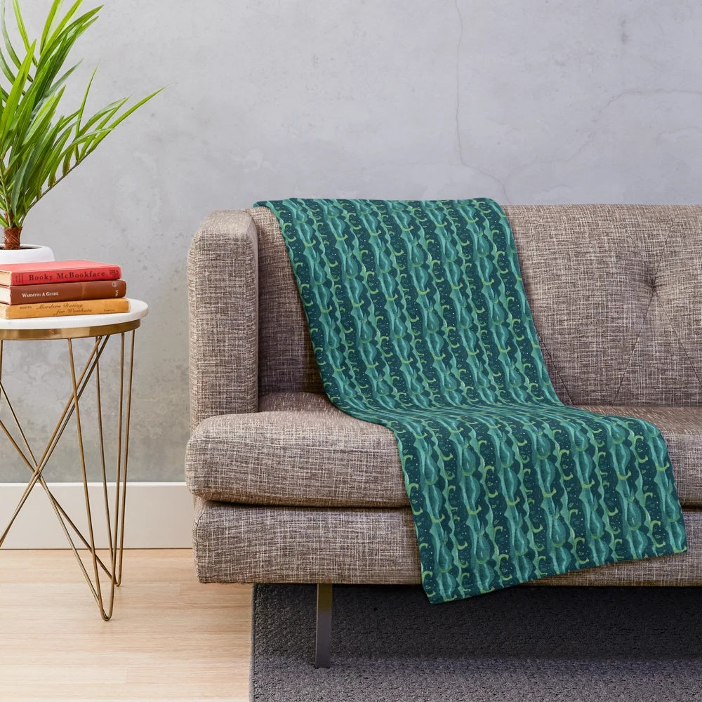 Loch Ness plush blanket featuring a vibrant, continuous pattern of the mythical creature