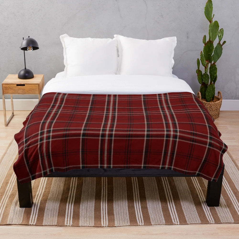 Soft and warm plush blanket featuring a traditional Scottish tartan design