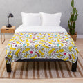 Plush blanket featuring a space rainbow motif with adorable cartoon corgis