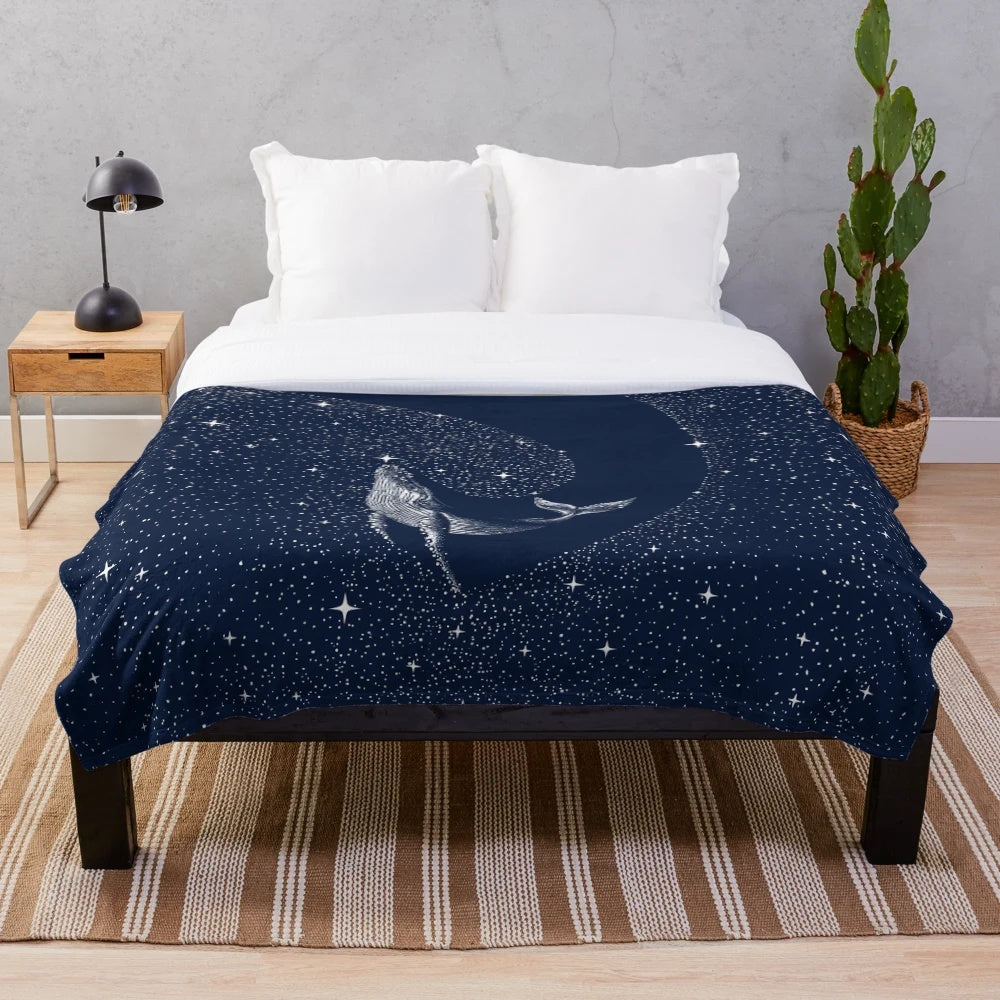 Starry whale plush blanket featuring a cosmic dreamscape design