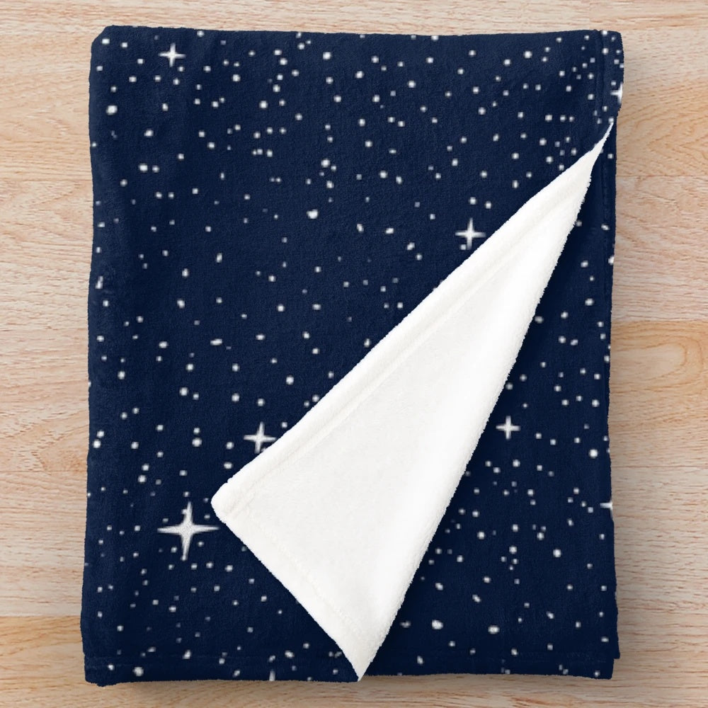 Starry whale plush blanket featuring a cosmic dreamscape design