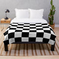 Soft, cozy plush blanket featuring a checkered flag design for racing car lovers
