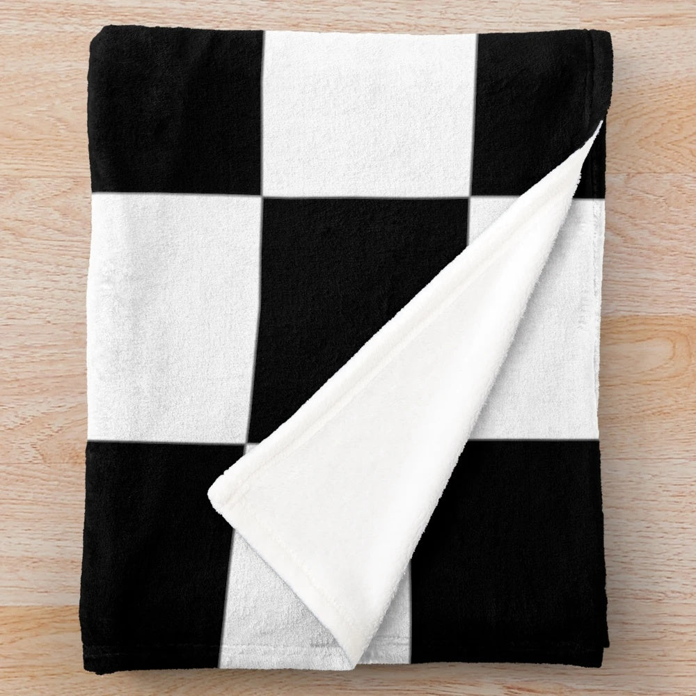 Soft, cozy plush blanket featuring a checkered flag design for racing car lovers