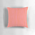 Stylish throw pillow with pink and orange brushstroke stripes for a preppy, summery look