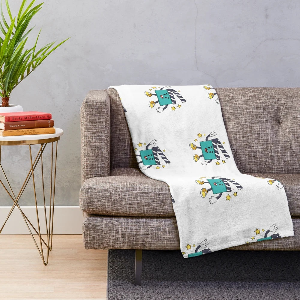 Minimalist movie-themed plush blanket featuring a clapper board mascot