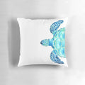 Coastal-themed watercolor painting of a sea turtle on a decorative pillow