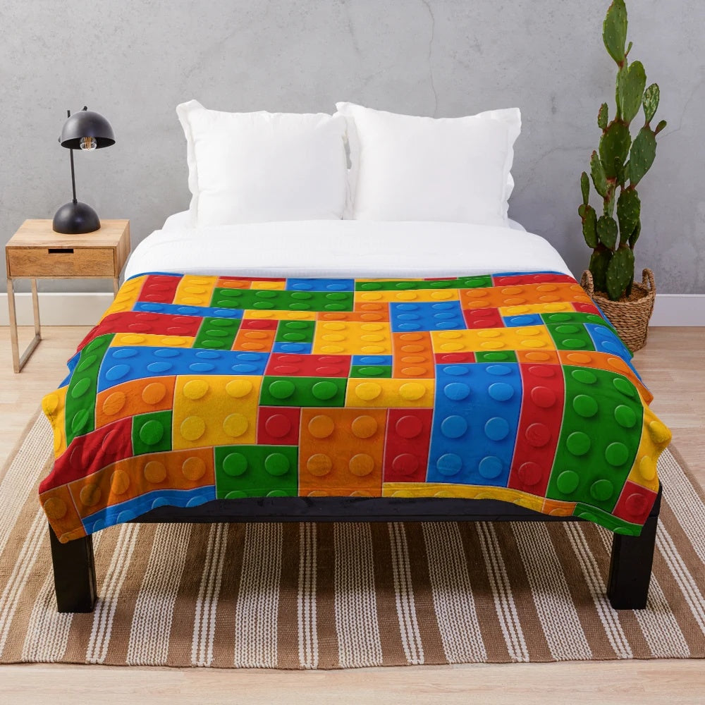 Plush blanket featuring colorful building blocks design