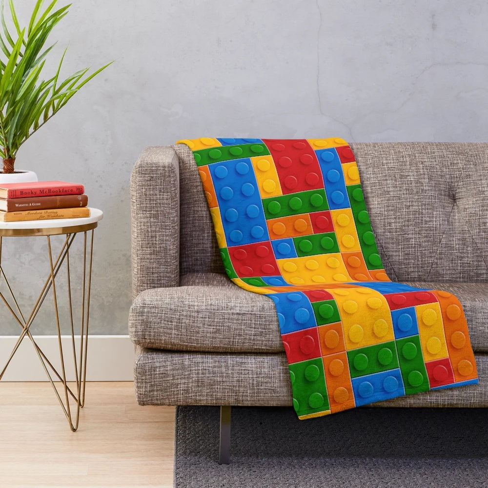 Plush blanket featuring colorful building blocks design