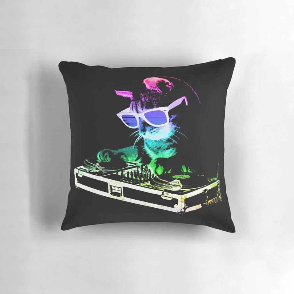 Colorful cat wearing DJ headphones and surrounded by music equipment on a decorative throw pillow