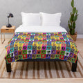Spelunky 2 inspired plush blanket with cute chibi characters in a multicolored design