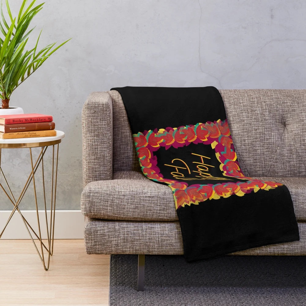 Colorful hand-drawn fall leaves on a plush blanket