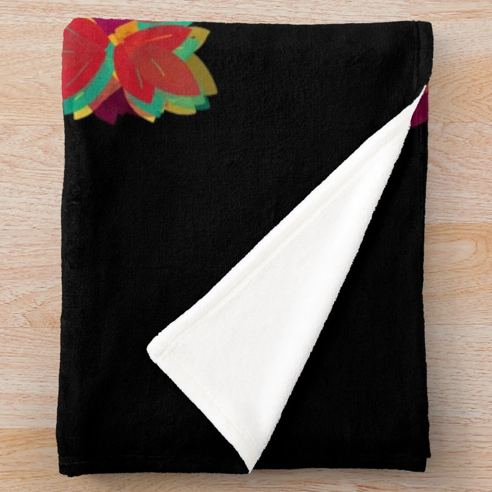 Colorful hand-drawn fall leaves on a plush blanket