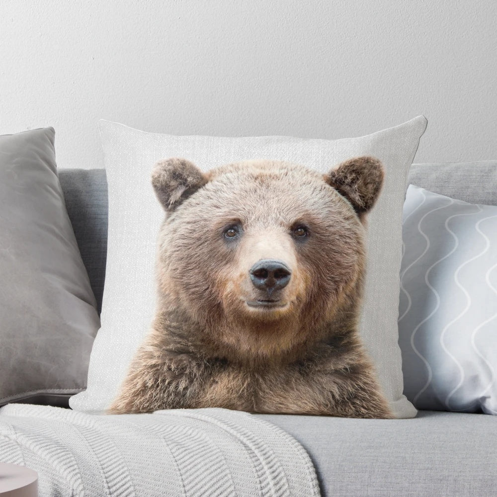 Vibrant illustration of a grizzly bear on a modern, minimalist throw pillow.