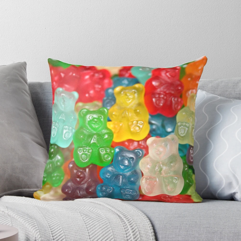 Vibrant gummy bear-shaped pillow in a rainbow of colors