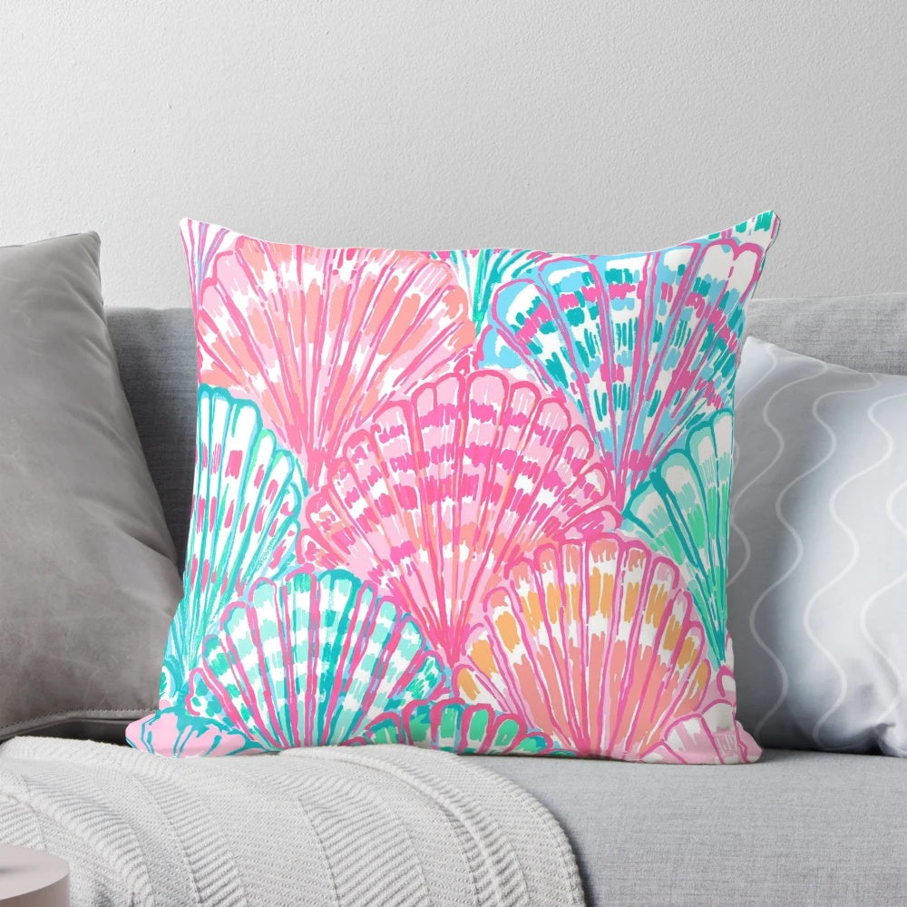 Vibrant and colorful shell-patterned pillow inspired by the iconic Lilly Pulitzer designs