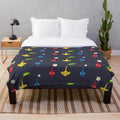 Vibrant Pikmin characters plush blanket featuring red, blue, and yellow Pikmin