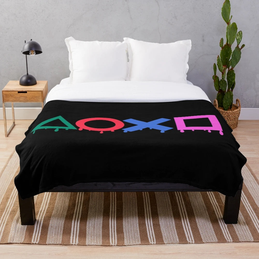Playstation-themed plush blanket with gaming symbols and controller