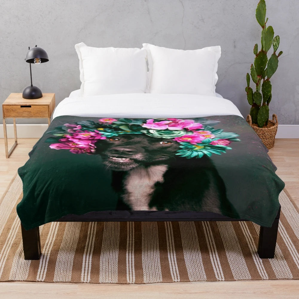 Plush blanket with vibrant floral designs and a happy pitbull