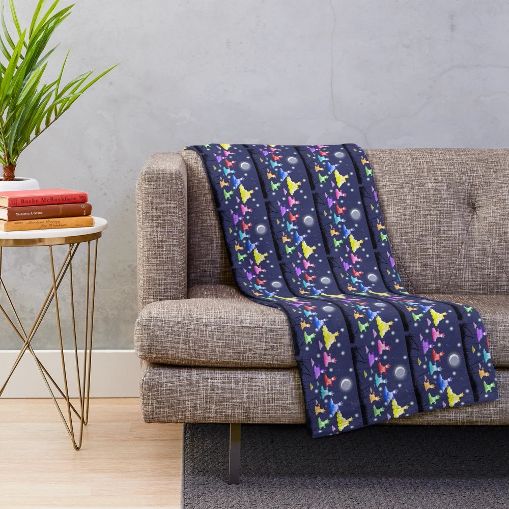 Colorful plush unicorn blanket featuring mythological creatures sleeping in clouds