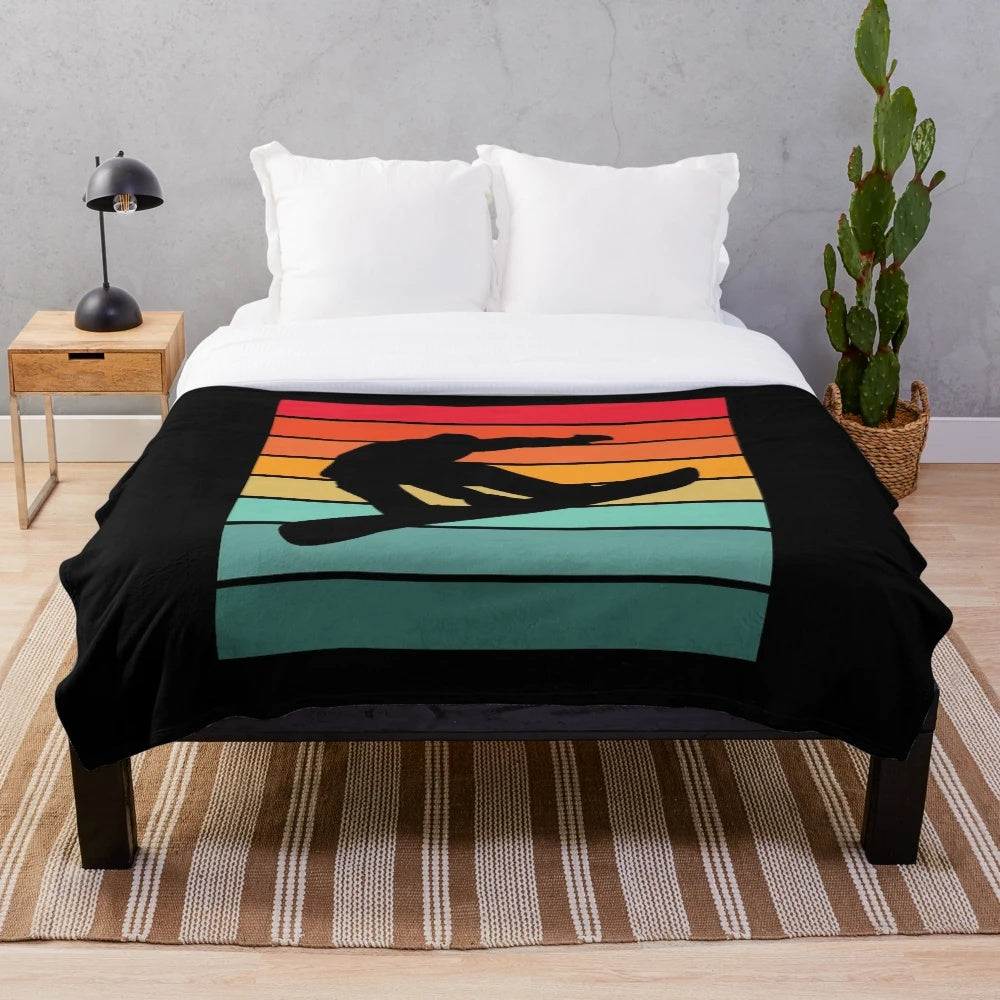 Colorful plush blanket featuring a snowboarding silhouette design