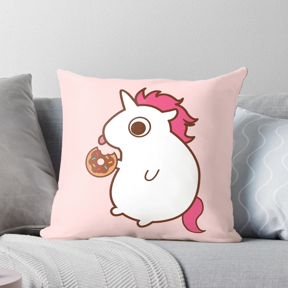 Vibrant throw pillow featuring a colorful unicorn design with candy, sweets, and pastry elements.