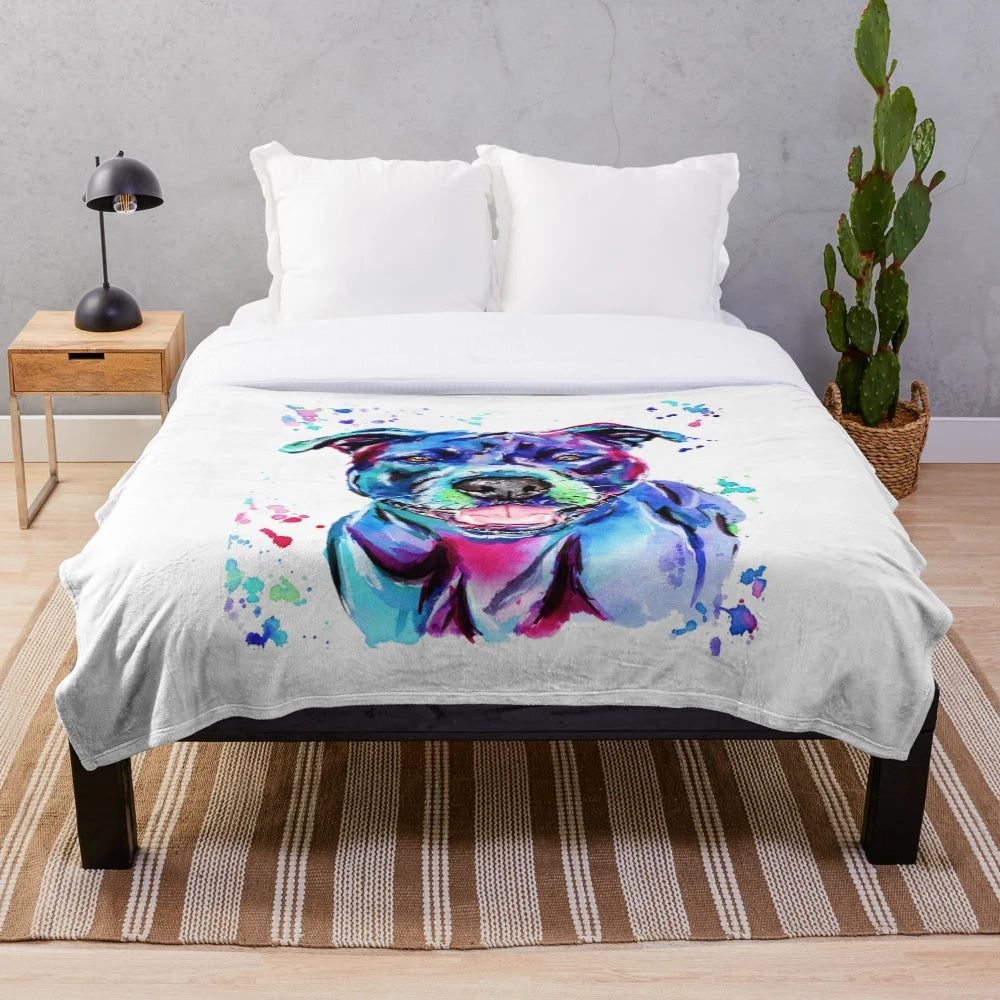 Vibrant watercolor painting of a Staffordshire Terrier dog on a soft, plush blanket