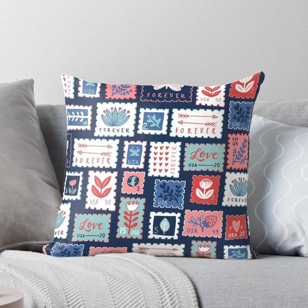 A plush, decorative pillow featuring the iconic USPS Forever Stamps design.