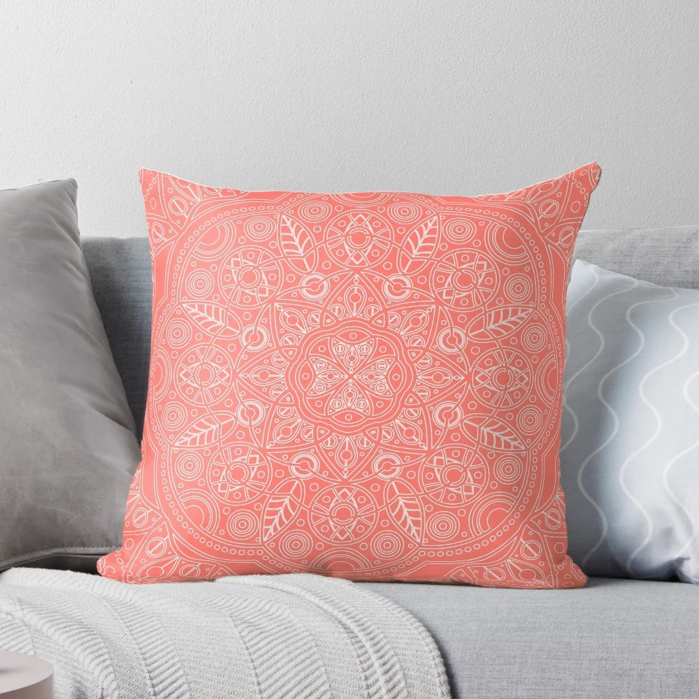 Coral and leaf mandala pattern printed on a plush, decorative pillow