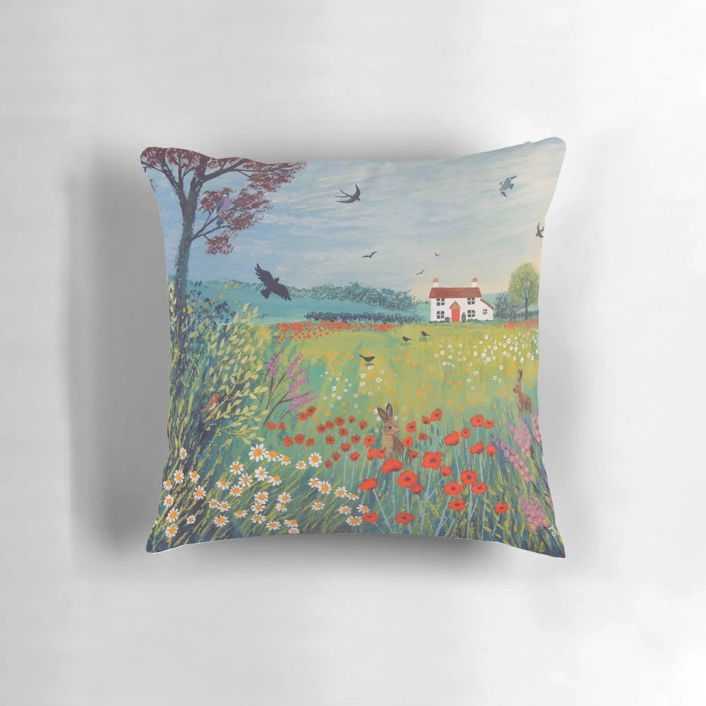 Pillow featuring a beautiful English countryside landscape with meadows, cottages, hares, and birds