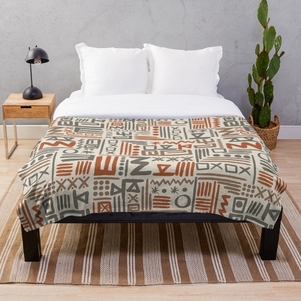 African-inspired plush blanket with traditional mudcloth pattern
