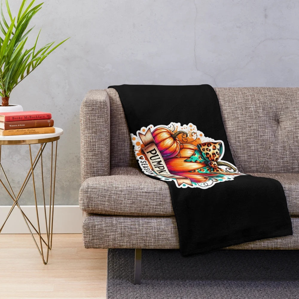 Plush blanket with a playful watercolor pumpkin design, perfect for autumn