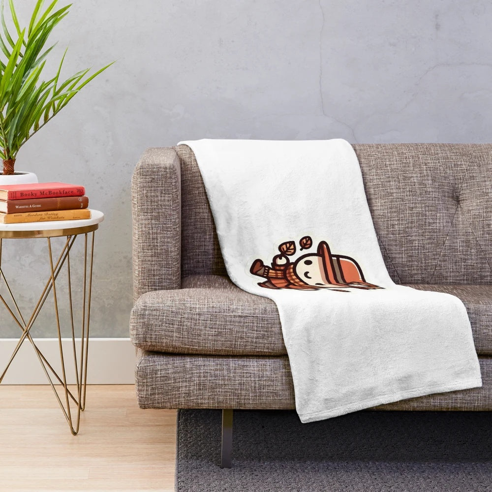 A cozy and warm plush blanket featuring fall foliage and cute chibi characters