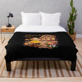Plush fall blanket with scarecrow and cottage design