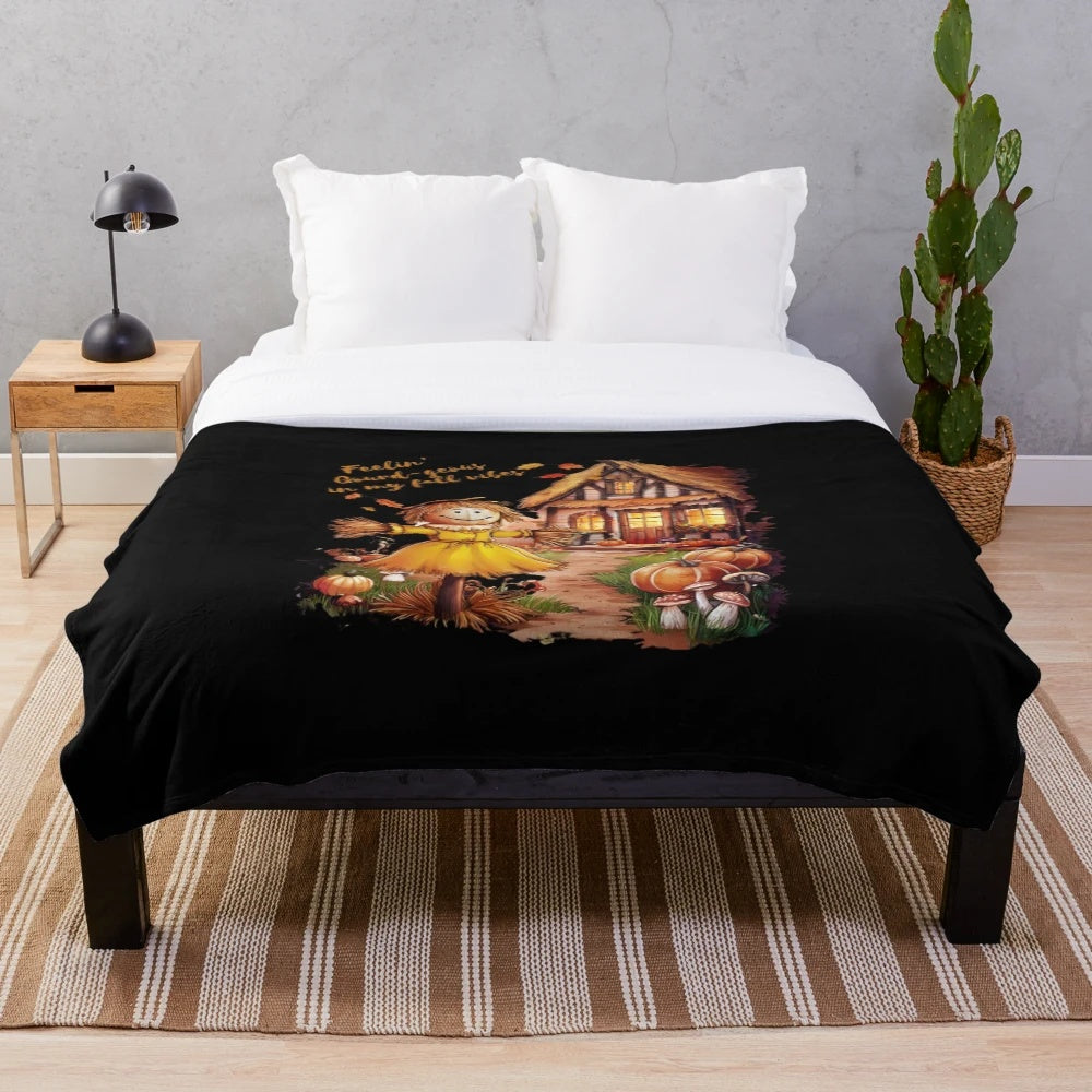 Plush fall blanket with scarecrow and cottage design