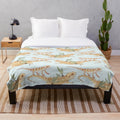 Plush bearded dragon-inspired blanket with a whimsical lizard and dragon pattern