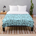 Black plush blanket with a clarinet music note pattern design