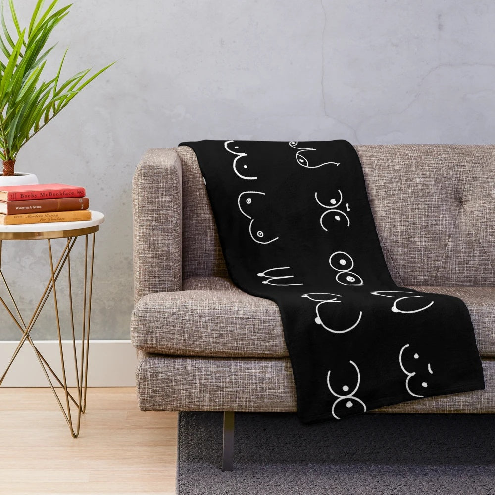 Cozy black plush blanket with a pastel pattern design