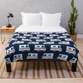 Blue plush blanket with mail truck and mail service design
