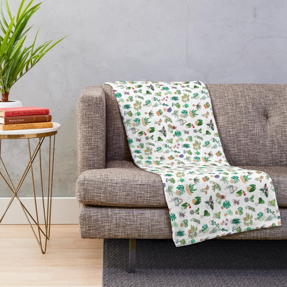 Plush blanket with a botanical plant alphabet pattern design