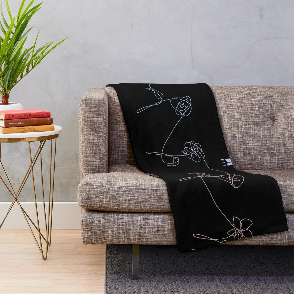 Soft and snuggly BTS-inspired plush blanket featuring the "Love Yourself" flower design
