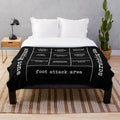 Plush cat-themed blanket with a "map" of a cat's territory on a bed