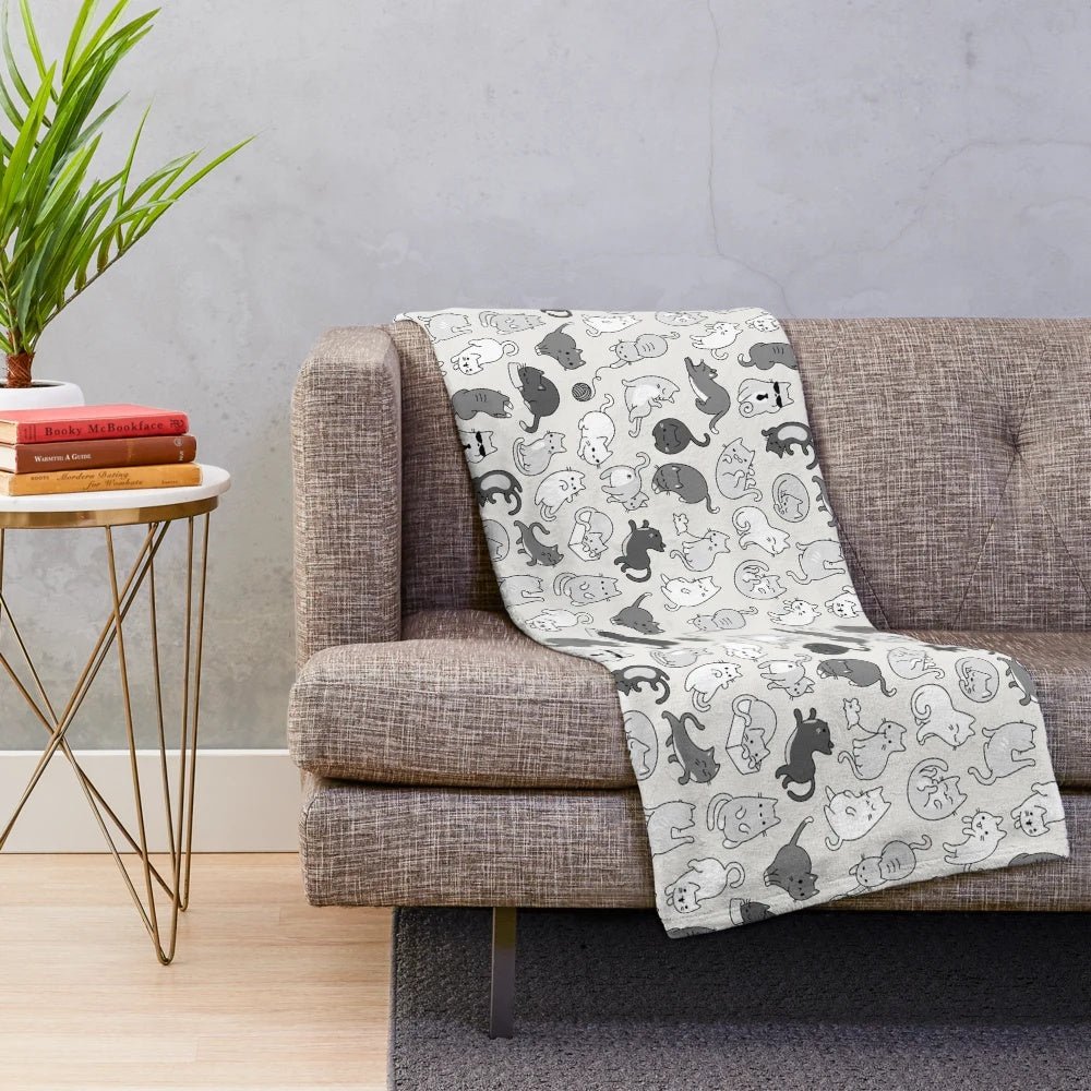 Cute illustrated cat pattern on a cozy plush blanket