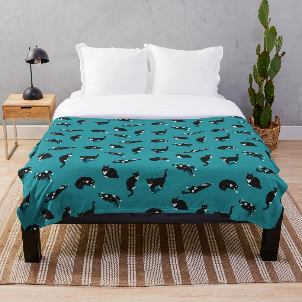 Cozy cat pattern plush blanket with black and white tuxedo cat design