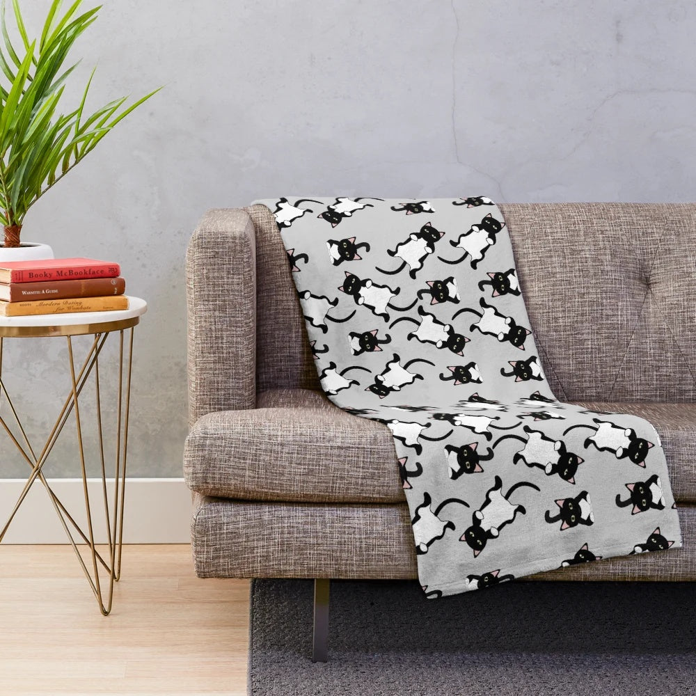 Fluffy plush blanket with a lazy black cat pattern design