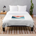 Soft and plush blanket featuring a colorful cat design