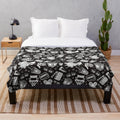 Cinema pattern plush blanket with white background and black design